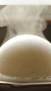 Close-up of Steaming Hot Traditional African Food Fufu or Ugali Served Fresh in a Bowl (5 Seconds)