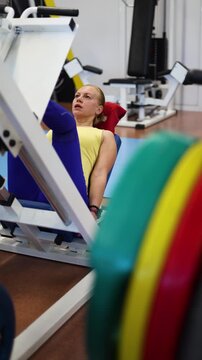 In this motivating clip, a middle-aged woman showcases her dedication to fitness by pushing her limits on the leg press machine, exemplifying strength, resilience, and focus.