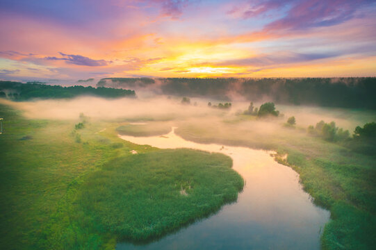 Magic serene dawn over the lake. Foggy early morning, rural landscape