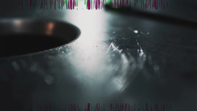Camera pulling focus revealing dark ridged part in lab exposing hole, hair, dust, glitch to inspect