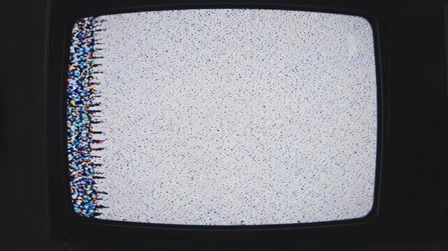 Retro television screen displaying static and color bars with subtle digital noise during a broadcast interruption