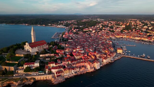 High-altitude aerial panorama of Rovinj, Croatia, revealing the historic peninsula surrounded by the Adriatic Sea. Mediterranean destination, cultural heritage and sustainable coastal tourism