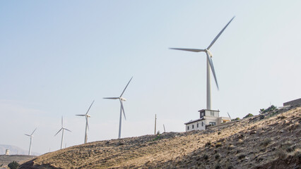 wind turbine in the wind © rezarafizadeh
