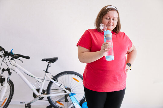 Person drinking water at bike training