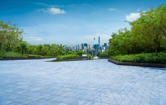 Kuala Lumpur skyline from park terrace on sunny day