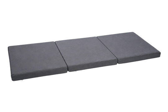 Long gray rectangular folding mattress with three distinct sections is angled on a clean white background