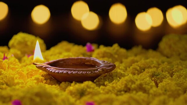 Clay diya lamps lit during diwali celebration, Diwali, or Deepavali, is India's biggest and most important holiday.