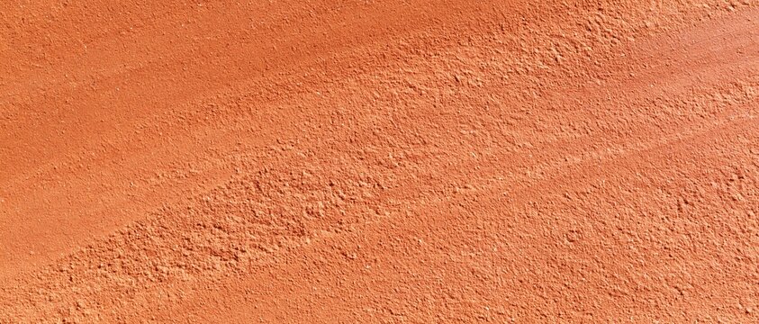 Coarse unglazed clay texture with visible grog particles in warm terracotta tones