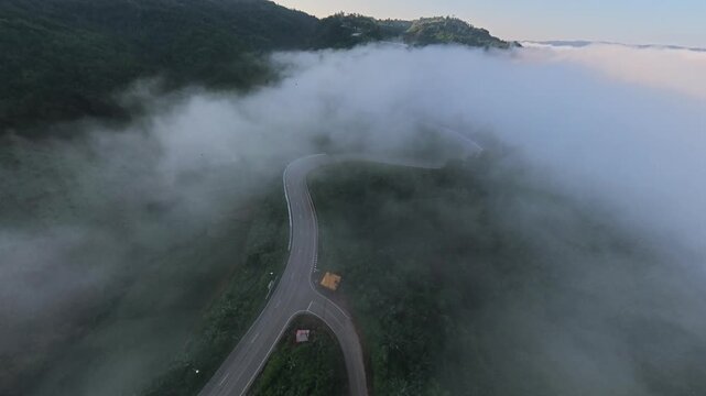 Winding Mountain Road Emerging Through Morning Mist, Phu Kao Ngom, Loei, Thailand