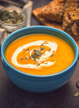 Fresh hot homemade pumpkin soup with cream