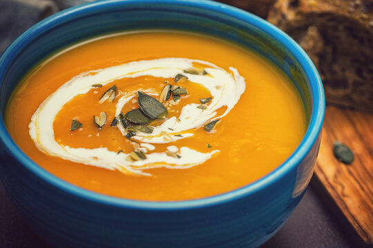 Fresh hot homemade pumpkin soup with cream