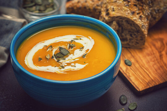 Fresh hot homemade pumpkin soup with cream