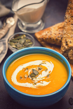 Fresh hot homemade pumpkin soup with cream