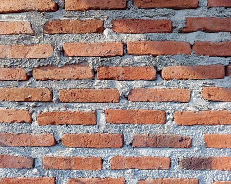 Old Red Brick Wall Texture Background with Cement Mortar Pattern