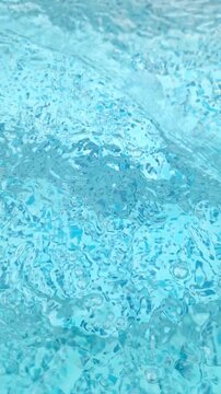 Turquoise swimming pool water ripples create shimmering fluid light refractions on the mosaic surface in sunlight. Ideal for advertising wellness, promoting leisure, and editorial media.