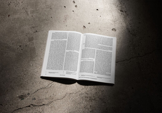 Mockup Of Customizable Open Book On Concrete Floor