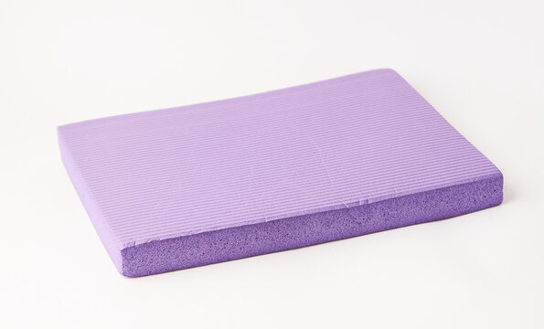 purple yoga mat with foam texture, porous structure detail