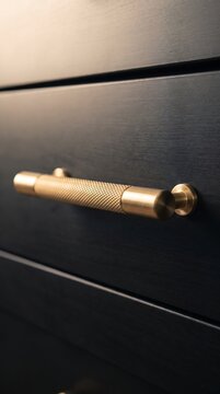 Elegant Brass Cabinet Handle on Matte Black Drawer, Minimalist Furniture Hardware Detail, Modern Interior Design, Luxury Home Decor, Stylish Kitchen and Storage Fixture