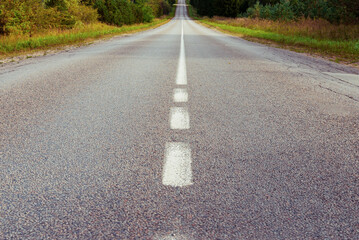 Scenic route on an asphalt road through an autumn landscape with text space. © ARVD73