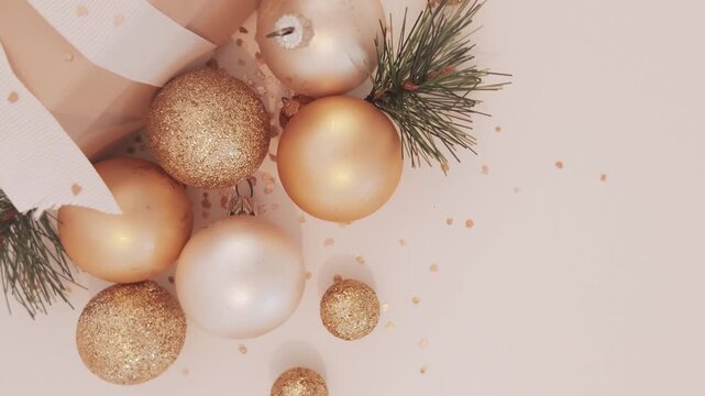 Festive Gold Baubles Surrounding Wrapped Holiday Gift Boxes