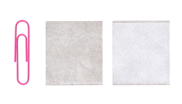 Set of pink paperclip and square tracing paper pieces on a transparent background
