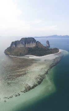 Aerial view, Chicken island at sunset with offshore reef, Koh Poda island, Krabi province, Thailand