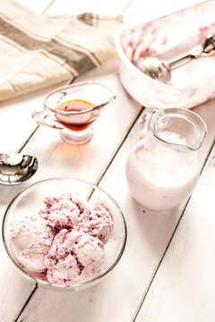 organic homemade ice cream in glass bowl on wooden background