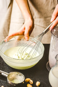 organic ice cream homemade process on dark background with hands