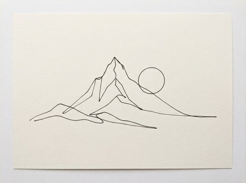 Minimalist mountain range sketch with a sun on textured paper in a wooden frame mountain landscape interior