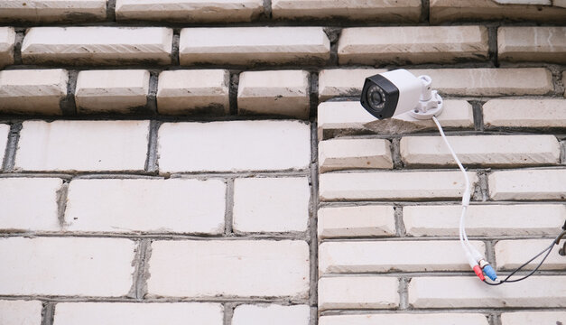 surveillance security camera video equipment on house wall outdoor
