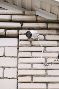 surveillance security camera video equipment on house wall outdoor