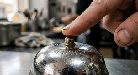 Finger pressing a metallic service bell on a counter. Generative AI. © anammarques