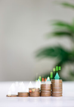 Stacks of coins with upward arrow and financial growth chart.
The graph shows the increase in compound interest over time. growth and success Invest in stock markets, funds and digital assets.