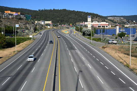 Kamloops, BC, Canada - July 18, 2026: A cars are driving along the highway near the city of Kamloops in British Columbia.Road in Canada.