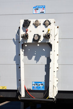 Berlin, Germany - August, 13 2026: Truck semi-trailer front panel with Haldex EB pneumatic brake connectors, electrical sockets, safe parking coupling instruction stickers, air hose couplings, cables