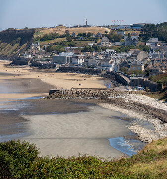 Arromanches-les-Bains, France - 08 10 2026:  Normandy landing blockhouse. Panoramic view of the artificial port with pontoons bridges, the beach, the sea, cliffs and the city from coastal path