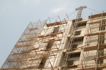 Architectural Building Construction Progress with Scaffolding Framework © Kreativ