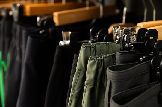 Clothing pants hanging on rack in retail store