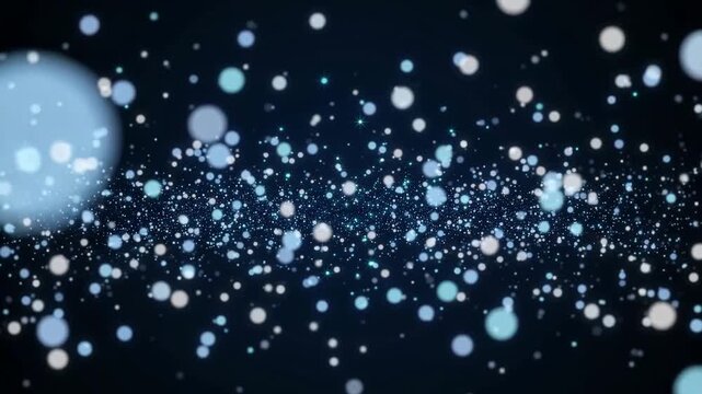 Abstract blue glitter particles floating on dark background, sparkling bokeh dust festive shimmer lights
