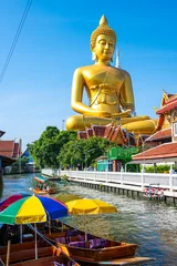 Longtail wooden boat travel at Giant Golden Buddha in Wat Paknam Phasi Charoen Temple on Chao Phraya River © themorningglory