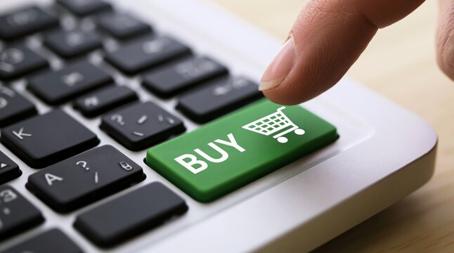Buy button on a computer keyboard with a finger pressing to make an online shopping purchase for ecommerce cart