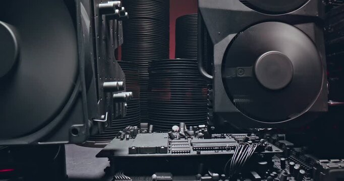 Working motherboards, fans and graphic cards. Camera move along components.