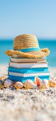 Obraz premium Straw hat and books on beach, summer reading vacation. Stacked books and a straw hat with seashells on a sandy beach by the ocean