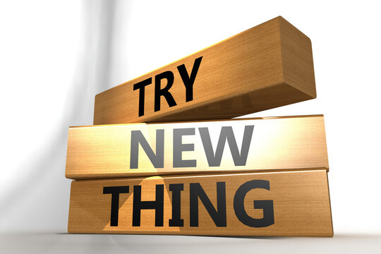 Try new thing word on wooden cube block