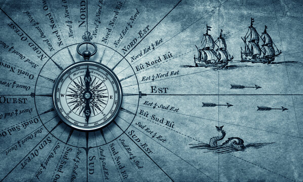 Magnetic old compass on world map. Travel, geography, history, navigation, tourism and exploration concept background. Retro compass on geography map. 