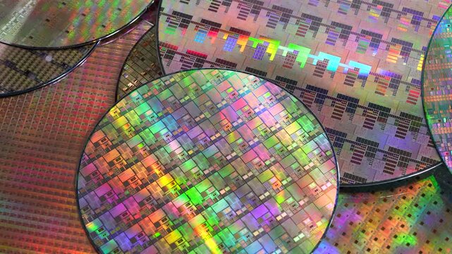 High-tech Macro Photography of a Colorful Silicon Wafer with Microchip Patterns for AI Hardware and Semiconductor Industry Concept.
