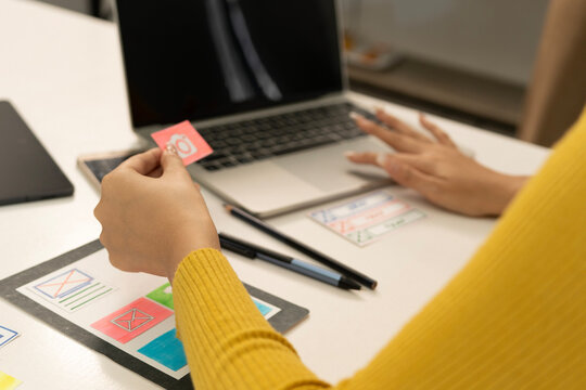 Creative web designer planning UI application and developing digital template