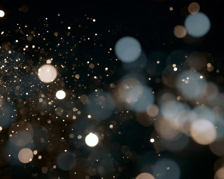 Soft bokeh lights create a dreamy depth with scattered glowing orbs. The out-of-focus circular shapes vary in intensity and size with warm golden and cool blue tones.