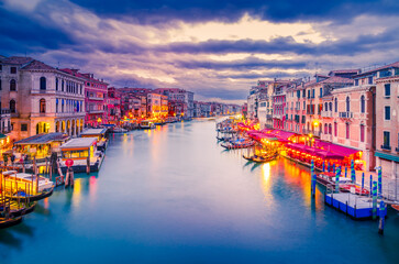 Venice, Italy. Beautiful sunset colors on Grand Canal, Rialto Bridge. © ecstk22
