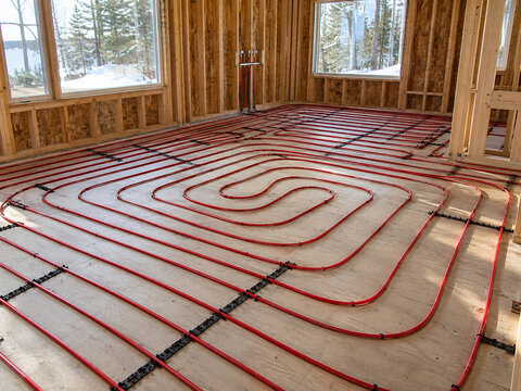 Hydronic radiant floor heating PEX tubing installed on residential subfloor